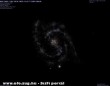 NGC 2403 as galaxis , háttérben pár másik galaxissal